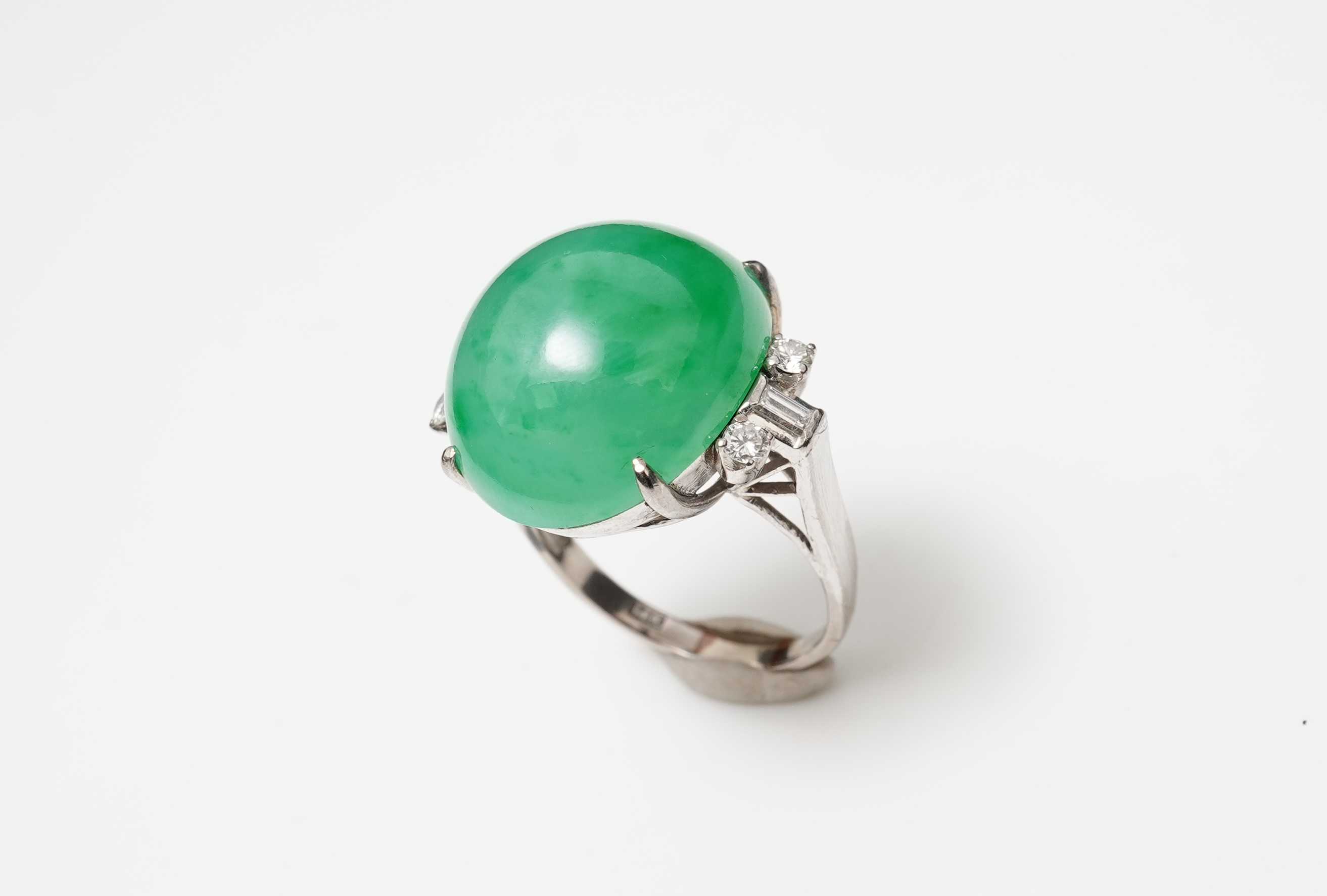 A jadeite and diamond ring